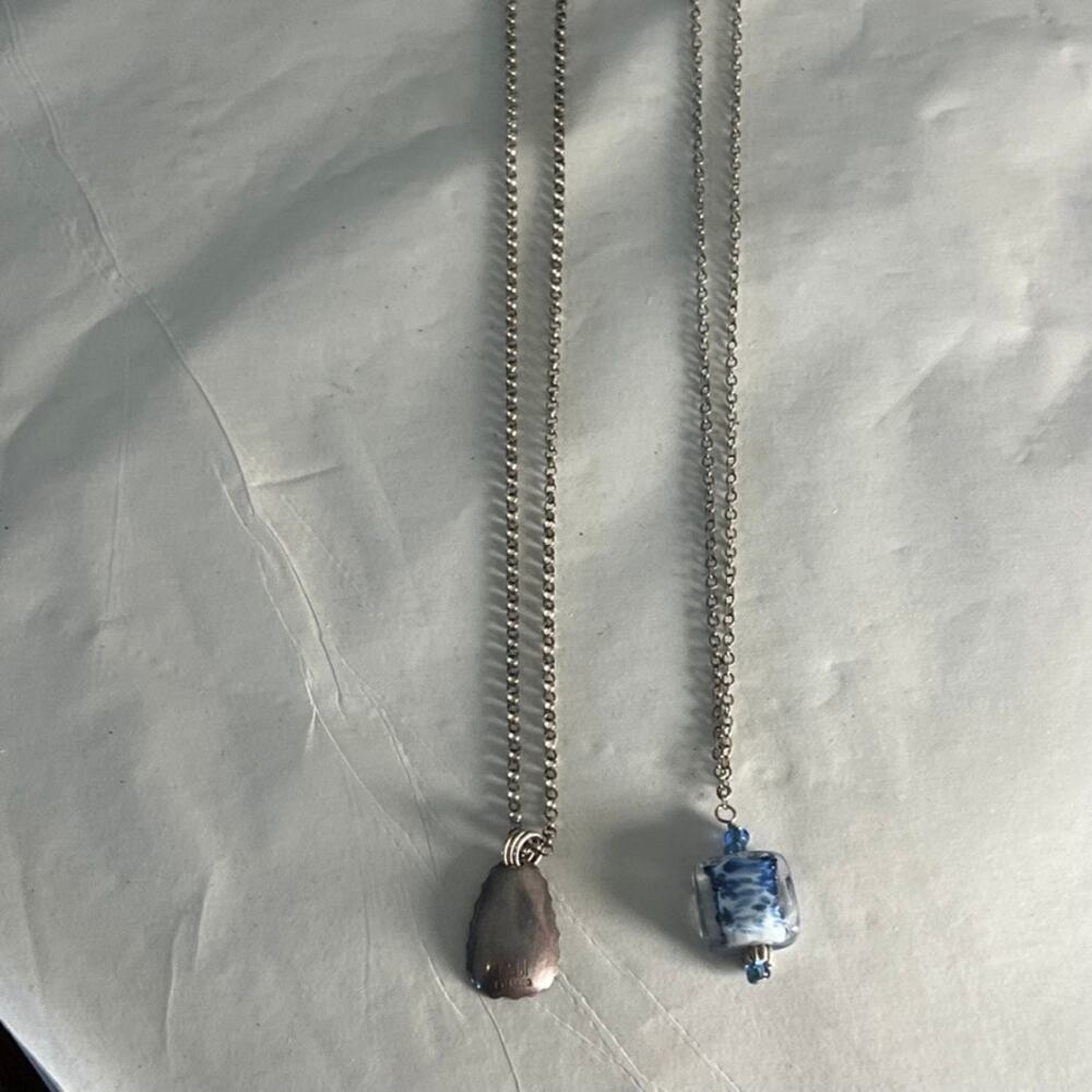 set of two silver necklaces blue glass pendant purple silver pendant